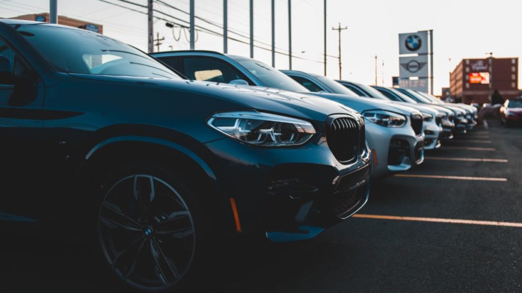Row of BMWs on lot at dealer
