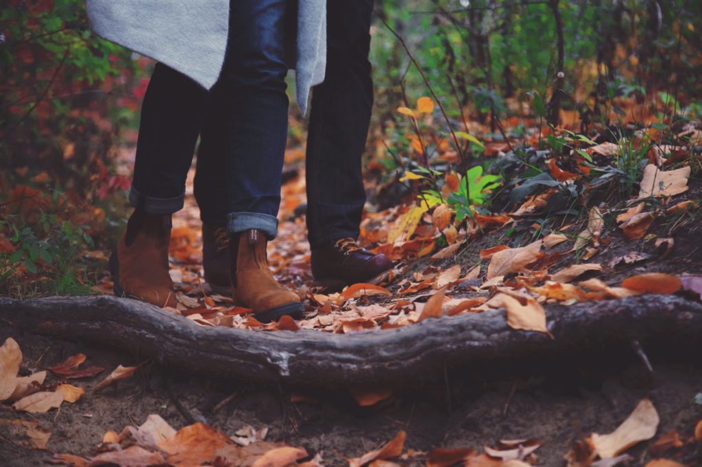 couple walking in leaves